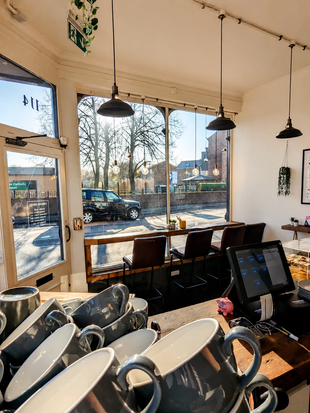 The bright front seating area and coffee counter at Busk